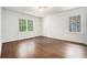 Sunlit bedroom with hardwood floors and windows that provide natural light and pleasant views at 3089 Marne Nw Dr, Atlanta, GA 30305