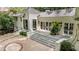 A striking white brick home with multi-level patios and lush landscaping at 3089 Marne Nw Dr, Atlanta, GA 30305