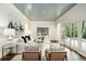 Elegant living room featuring soft lighting, neutral furniture, and a wall of French doors at 3089 Marne Nw Dr, Atlanta, GA 30305