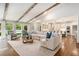 Open living room with beamed ceilings and plenty of natural light at 3089 Marne Nw Dr, Atlanta, GA 30305
