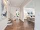 Inviting entryway with hardwood floors, modern decor, and stairs leading up to the second level at 3089 Marne Nw Dr, Atlanta, GA 30305
