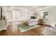 Spacious main bedroom featuring hardwood floors, a seating area, and natural light from multiple windows at 3089 Marne Nw Dr, Atlanta, GA 30305