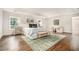 Spacious main bedroom with hardwood floors, large windows, and sitting area at 3089 Marne Nw Dr, Atlanta, GA 30305