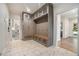 Well-organized mudroom featuring custom cabinetry, bench seating, and decorative tile flooring at 3089 Marne Nw Dr, Atlanta, GA 30305