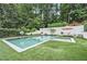 Beautiful backyard pool and spa features a basketball hoop and lounge seating at 3089 Marne Nw Dr, Atlanta, GA 30305