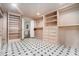 Spacious walk-in closet with custom shelving, drawers, and rod space for organized storage at 3089 Marne Nw Dr, Atlanta, GA 30305