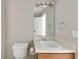 Bathroom with single sink vanity and a framed mirror at 400 Rustin Dr, Dallas, GA 30157