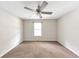 Spacious bedroom with neutral walls, carpet, and ceiling fan at 400 Rustin Dr, Dallas, GA 30157