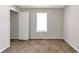Bedroom featuring carpeted floors, a window, and a closet at 400 Rustin Dr, Dallas, GA 30157