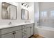 Bathroom with double vanity, tub, shower, and modern fixtures at 800 Old Plank Sq, Duluth, GA 30097