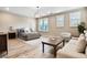 Spacious bedroom boasting ample natural light, sitting area, and stylish decor at 800 Old Plank Sq, Duluth, GA 30097