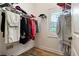 Walk-in closet with ample storage and a window providing natural light at 800 Old Plank Sq, Duluth, GA 30097
