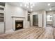 Living room with fireplace, built-in shelves, and adjoining closet at 800 Old Plank Sq, Duluth, GA 30097