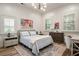 Serene bedroom with hardwood floors, two windows, and tasteful decor at 800 Old Plank Sq, Duluth, GA 30097