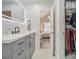 Modern bathroom with gray vanity, closet and updated fixtures at 2026 Patterson Park Pl, Lawrenceville, GA 30044