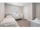Bedroom with single bed, crib, and neutral color scheme at 2026 Patterson Park Pl, Lawrenceville, GA 30044