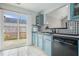 Kitchen featuring blue cabinets, black countertops and stainless appliances at 2026 Patterson Park Pl, Lawrenceville, GA 30044