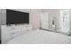 Tranquil bedroom with wood floors, modern furnishings, and easy access to an updated bathroom at 2026 Patterson Park Pl, Lawrenceville, GA 30044