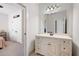 Bathroom with white vanity, large mirror, and modern light fixture at 2360 Whispering Nw Dr, Kennesaw, GA 30144