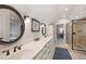 Bathroom with double sinks, large countertop, and glass enclosed shower at 2360 Whispering Nw Dr, Kennesaw, GA 30144