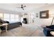 Large primary bedroom features a ceiling fan, big windows, and ensuite bathroom at 2360 Whispering Nw Dr, Kennesaw, GA 30144