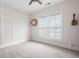 Bright, airy bedroom with large windows, neutral paint, plush carpeting and decorative trim at 2360 Whispering Nw Dr, Kennesaw, GA 30144