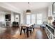 Open dining area with a fireplace and hard wood floors, providing a warm and inviting space at 2360 Whispering Nw Dr, Kennesaw, GA 30144