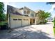 Lovely home with a two-car garage and ample parking, with view of the lush landscaping at 2360 Whispering Nw Dr, Kennesaw, GA 30144