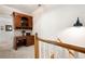 Upstairs landing with built-in wood office space and great natural light at 2360 Whispering Nw Dr, Kennesaw, GA 30144