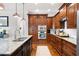 Well-equipped kitchen with granite countertops, stainless steel appliances, and plenty of cabinet space at 2360 Whispering Nw Dr, Kennesaw, GA 30144
