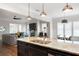 Open-concept kitchen with a large island and modern appliances, seamlessly flowing into the living area at 2360 Whispering Nw Dr, Kennesaw, GA 30144
