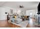 Open living room featuring hardwood floors, fireplace, and a view of staircase to the second floor at 2360 Whispering Nw Dr, Kennesaw, GA 30144