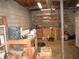 Unfinished basement with concrete block walls and exposed wood beams and duct work at 4098 Nancy Creek Ne Way, Brookhaven, GA 30319
