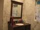 Bathroom features marble walls, a granite vanity, and a dark wood-framed mirror at 4098 Nancy Creek Ne Way, Brookhaven, GA 30319