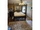 Bedroom with ceiling fan and four-poster bed with floral accents at 4098 Nancy Creek Ne Way, Brookhaven, GA 30319