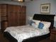 Cozy bedroom with blue walls, hardwood floors, and a queen-sized bed with decorative pillows at 4098 Nancy Creek Ne Way, Brookhaven, GA 30319
