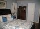 Comfortable bedroom with blue walls, hardwood floors, and a queen-sized bed with decorative pillows at 4098 Nancy Creek Ne Way, Brookhaven, GA 30319