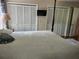 Bedroom featuring a bed with white covers and ample closet storage at 4098 Nancy Creek Ne Way, Brookhaven, GA 30319