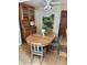 Dining room features a wooden table with chairs, a built-in cabinet, and a decorative wall design at 4098 Nancy Creek Ne Way, Brookhaven, GA 30319