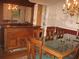 Elegant dining room showcasing vintage furniture, floral wallpaper, and hardwood flooring at 4098 Nancy Creek Ne Way, Brookhaven, GA 30319