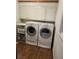Bright laundry room with modern white appliances and built in cabinets at 4098 Nancy Creek Ne Way, Brookhaven, GA 30319
