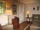 Living room featuring neutral walls, hardwood floors, lamps, and a seating area with a patterned rug at 4098 Nancy Creek Ne Way, Brookhaven, GA 30319