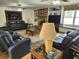 Cozy living room with a brick fireplace, hardwood floors, and comfortable seating at 4098 Nancy Creek Ne Way, Brookhaven, GA 30319