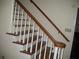 Carpeted staircase with dark wood railings and white risers for a classic look at 4098 Nancy Creek Ne Way, Brookhaven, GA 30319