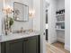 Modern bathroom with a stylish mirror, gold fixtures, and a marble countertop at 658 Bull Se St, Atlanta, GA 30315