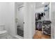 Modern bathroom with a glass-enclosed shower and walk-in closet, maximizing space and functionality at 658 Bull Se St, Atlanta, GA 30315