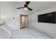 Cozy bedroom showcasing a modern ceiling fan and TV, creating a comfortable and stylish retreat at 658 Bull Se St, Atlanta, GA 30315