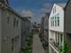 View down a street between modern townhomes, featuring balconies and manicured landscaping at 658 Bull Se St, Atlanta, GA 30315