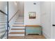Bright foyer with hardwood floors, coat closet, and staircase, offering a warm welcome at 658 Bull Se St, Atlanta, GA 30315