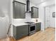 Modern kitchen featuring shaker cabinets, stainless steel appliances, and white subway tile backsplash at 658 Bull Se St, Atlanta, GA 30315